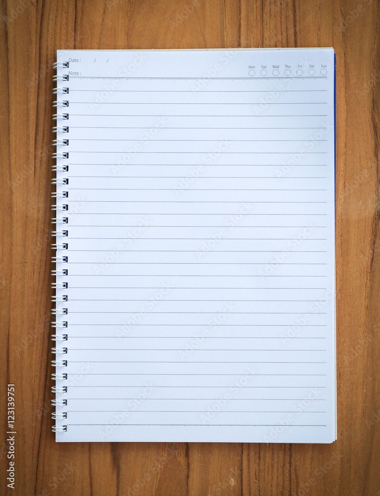 Top view blank notebook on wood background. Top view blank notebook on wood background.