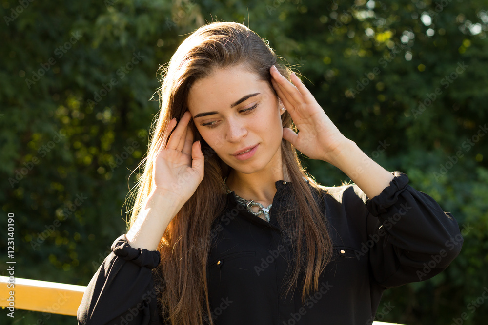 Young woman on the background of trees Young woman on the background of trees