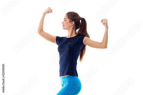 Smiling woman showing biceps