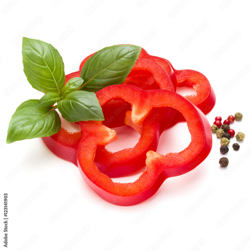 Red sweet bell pepper slices and basil leaves isolated on white