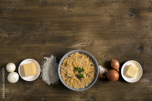 Risotto with mushrooms, fresh herbs and parmesan cheese photo