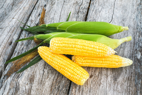 sweetcorn on wooden background.