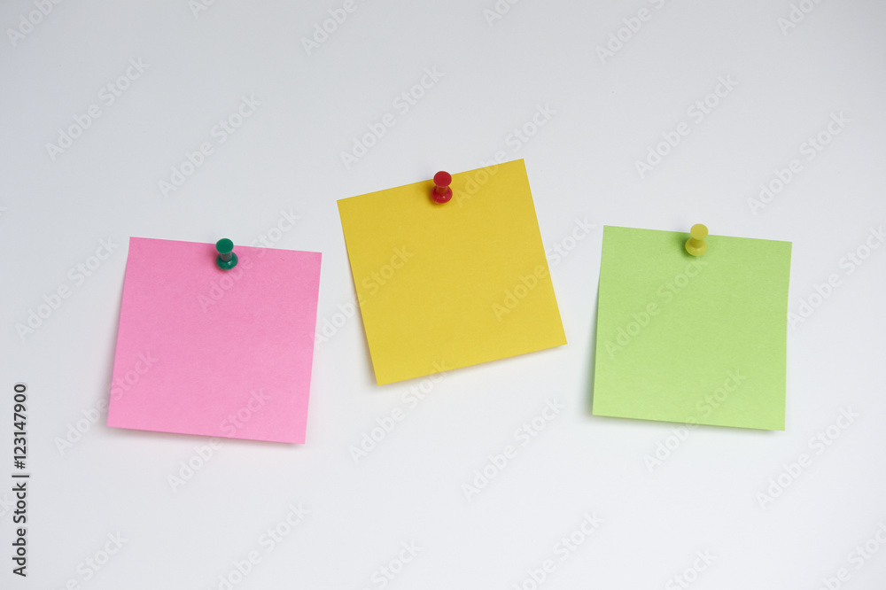 Three sticky notes with push pins on white background Three sticky notes with push pins on white background