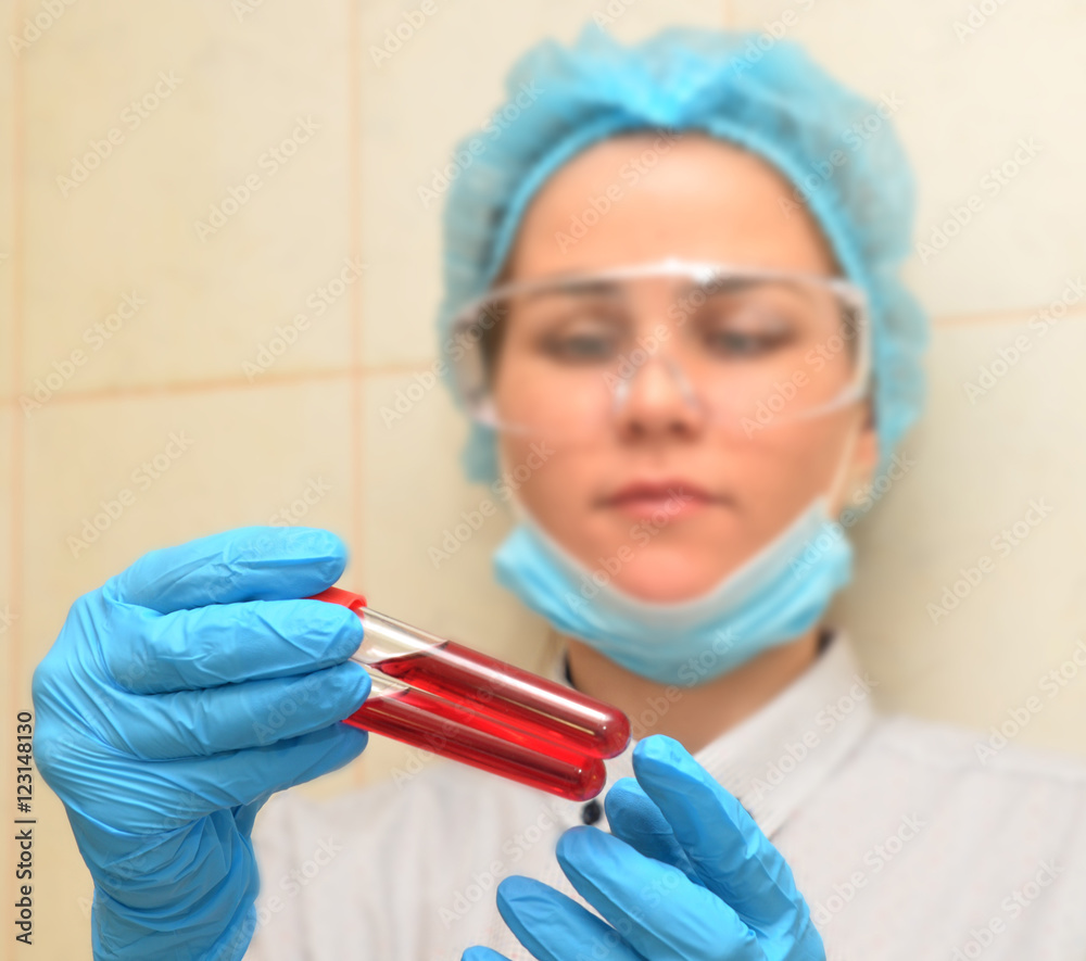 Medical worker is analyzing blood test Medical worker is analyzing blood test