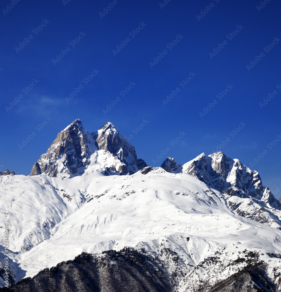 Snow mountains in winter at sun day