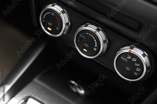 Interior of a modern car, Car Air Conditioner buttons. © structuresxx