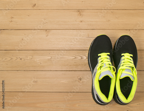 Sports accessories for fitness on the wooden floor. © kvladimirv