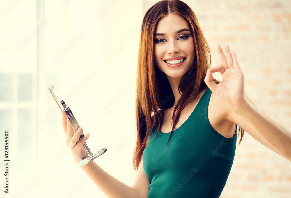 Young woman with mirror indoors Young woman with mirror indoors