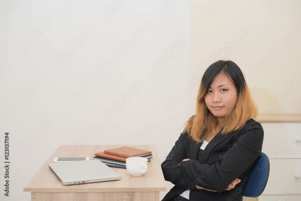 Businesswoman drinking coffee working on his laptop on the desk Businesswoman drinking coffee working on his laptop on the desk