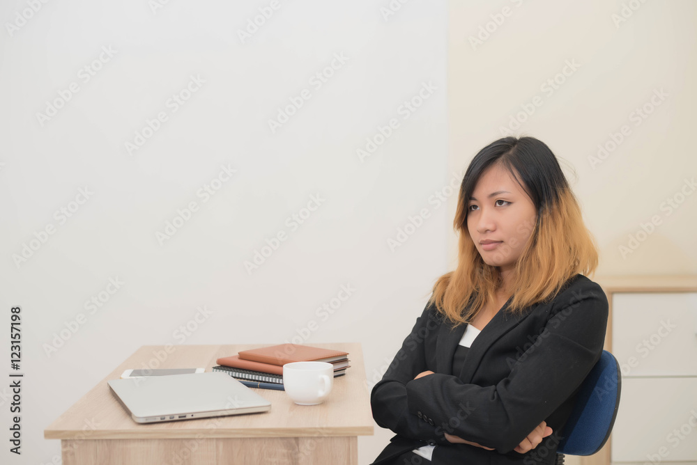 Businesswoman drinking coffee working on his laptop on the desk Businesswoman drinking coffee working on his laptop on the desk