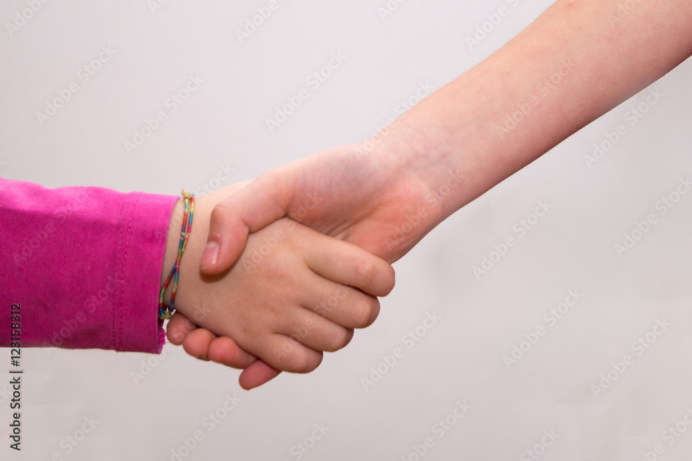 Fototapeta premium intertwined hands of girls, hands touching