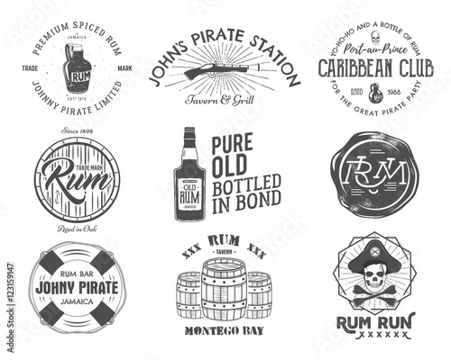Set of vintage handcrafted emblems, labels, logos. Isolated on a white background. Sketching filled style. Pirate and sea symbols - old rum bottles, barrels, skull, pistol. Vector