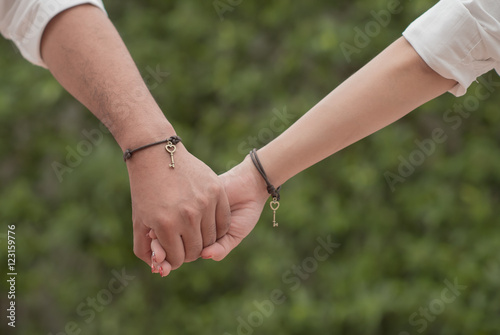 Happy couple holding hands