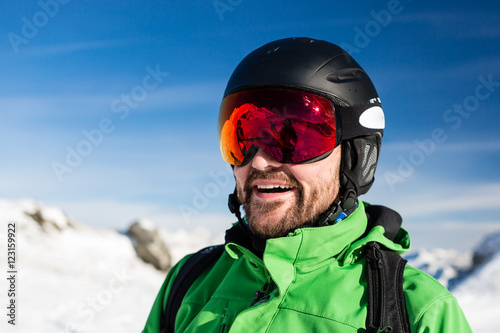 Happy skier with large oversized ski goggles © Mikkel Bigandt