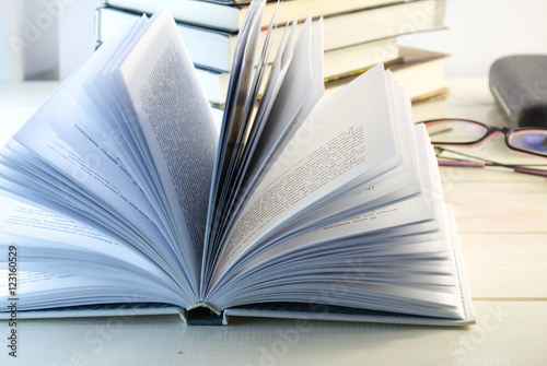 stack of books and opened book