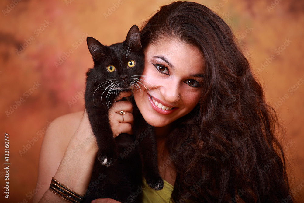 girl with a black cat on a yellow background girl with a black cat on a yellow background
