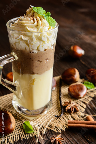 Vanilla pudding with chestnuts puree and whipped cream in a glass jar © noirchocolate