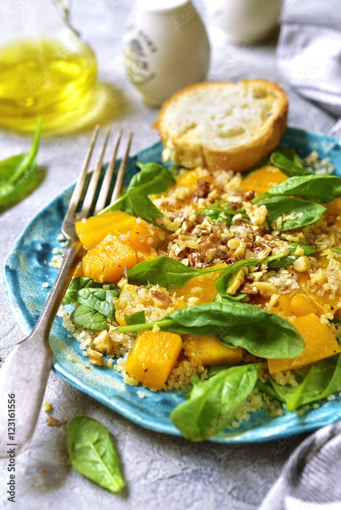 Pumpkin salad with quinoa,spinach and walnuts.