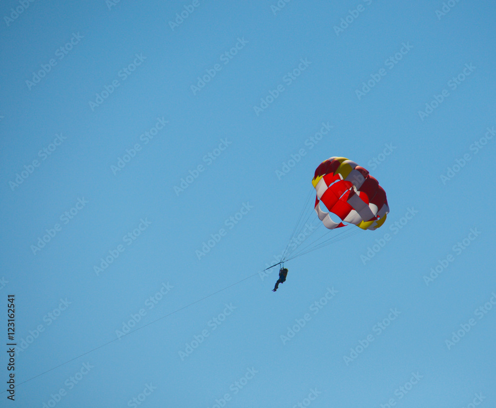 Parachute against the backdrop of clear sky Parachute against the backdrop of clear sky