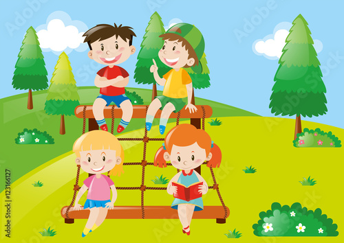 Four kids playing at climbing station