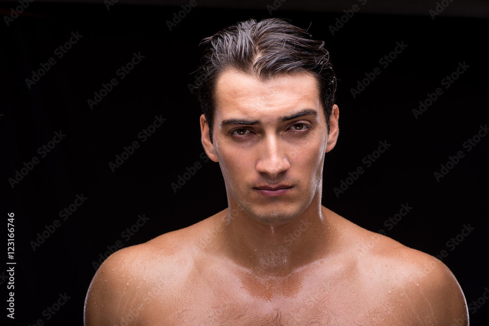 Fototapeta premium Ripped muscular handsome man on black background