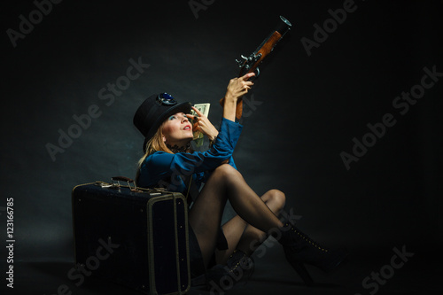 Steampunk girl with cash. © Voyagerix
