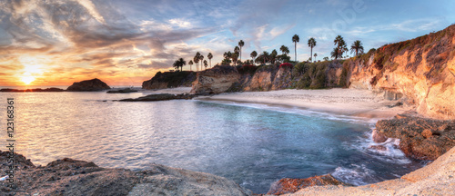 Leinwand Poster Sunset view of Treasure Island Beach at the Montage in Laguna Beach, California,