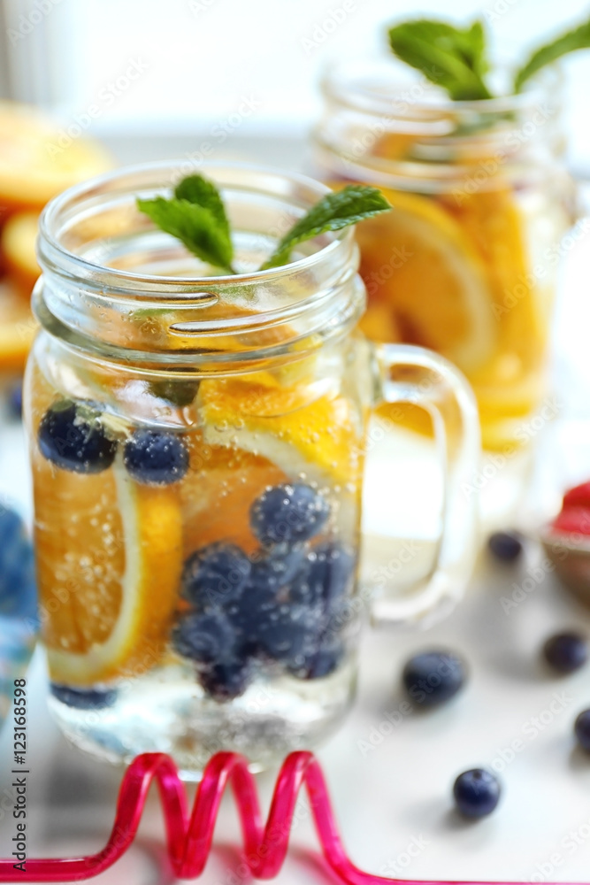 Refreshing water with fruits, closeup Refreshing water with fruits, closeup
