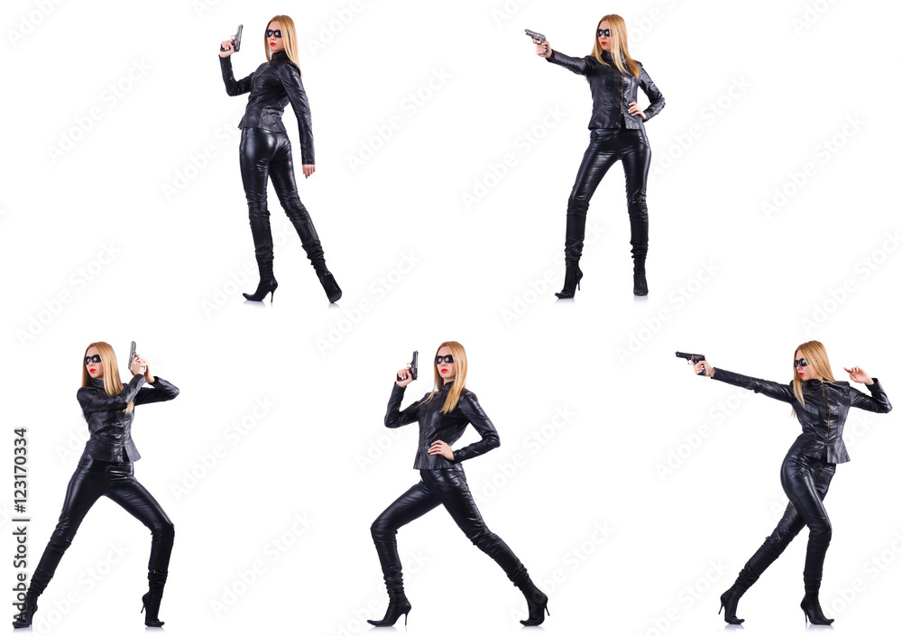 Woman in leather costume with gun isolated on white Woman in leather costume with gun isolated on white
