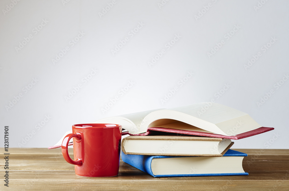 Fototapeta premium Books. With a coffee cup.