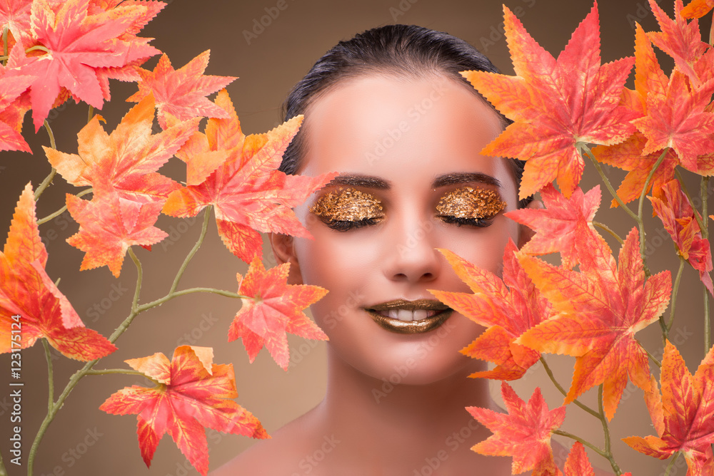Young woman with dry autumn leaves Young woman with dry autumn leaves