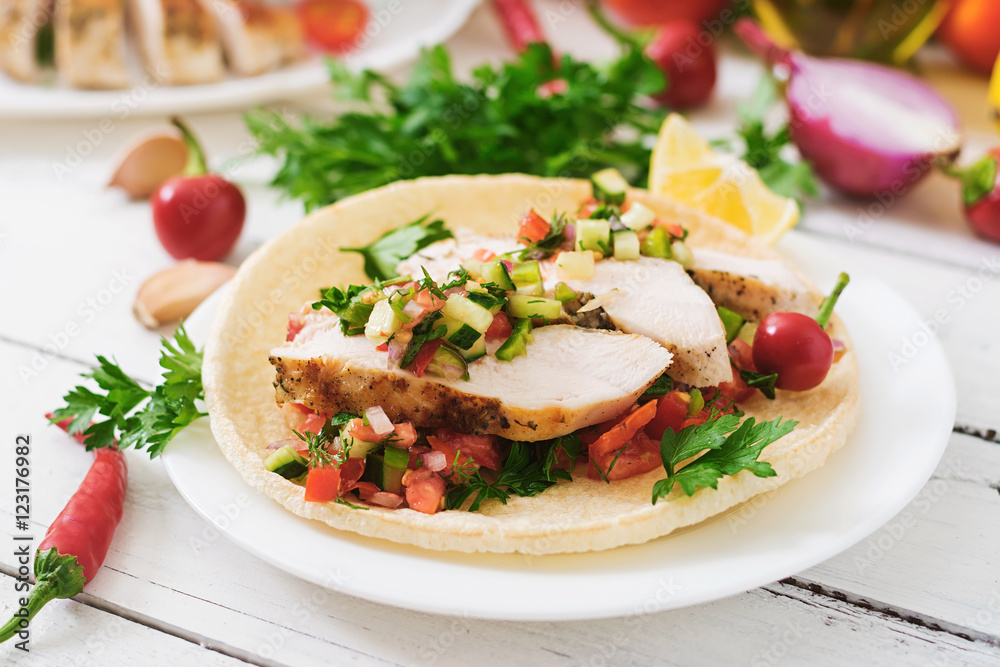 Mexican tacos with chicken and salsa. Mexican tacos with chicken and salsa.