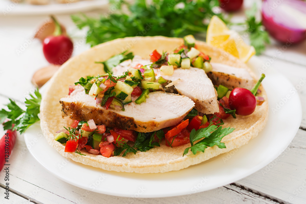 Mexican tacos with chicken and salsa. Mexican tacos with chicken and salsa.