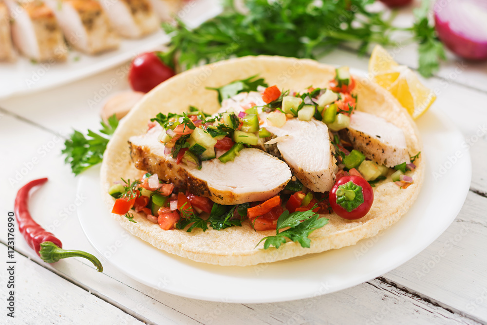 Mexican tacos with chicken and salsa. Mexican tacos with chicken and salsa.