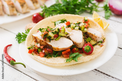 Mexican tacos with chicken and salsa.
