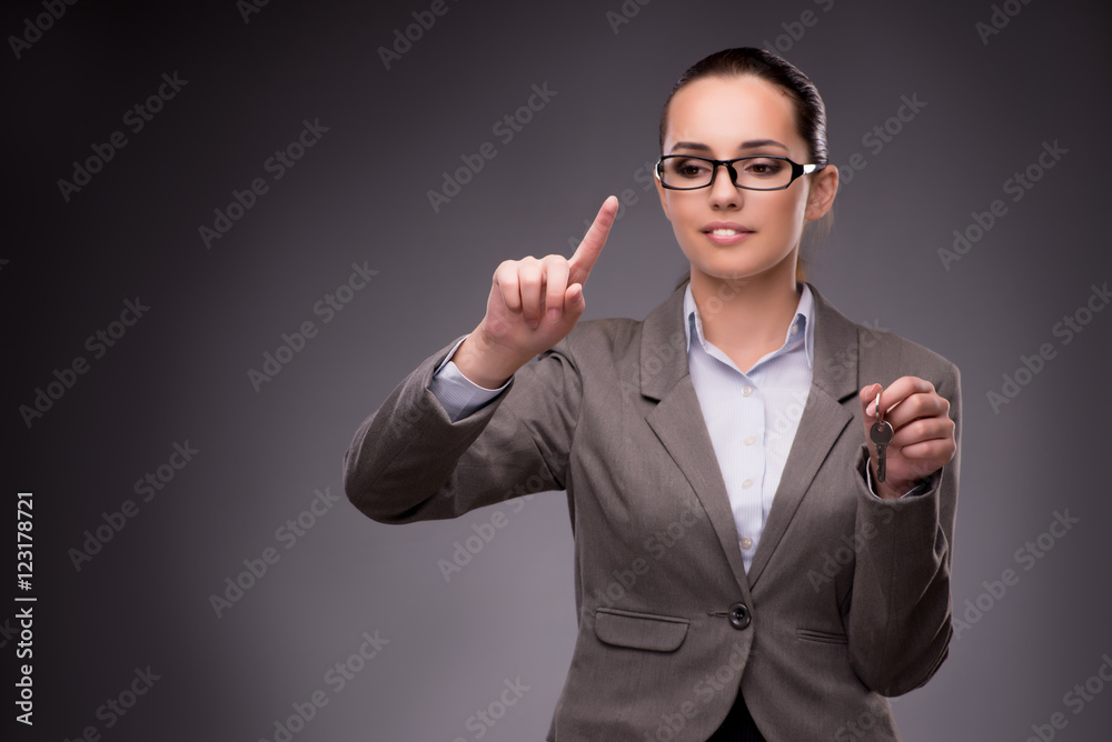 Woman holding keys in housing mortgage concept Woman holding keys in housing mortgage concept