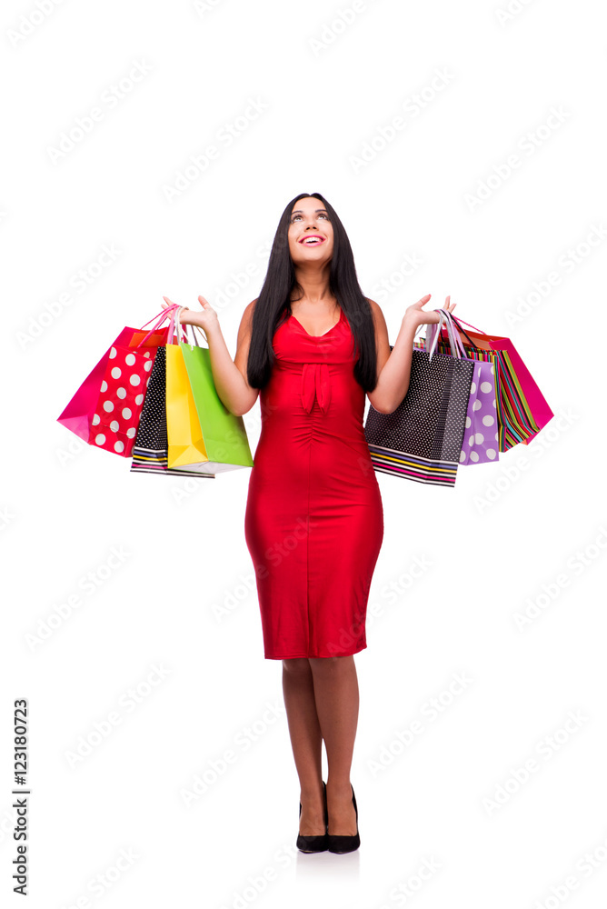 Woman in red dres after shopping isolated on white