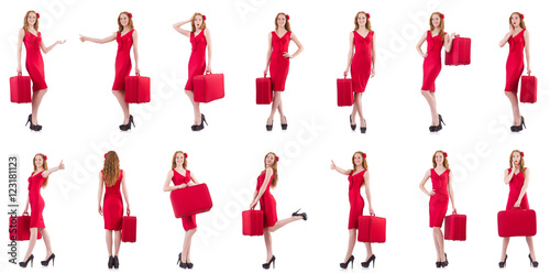 Young woman in red dress with suitcase isolated on white