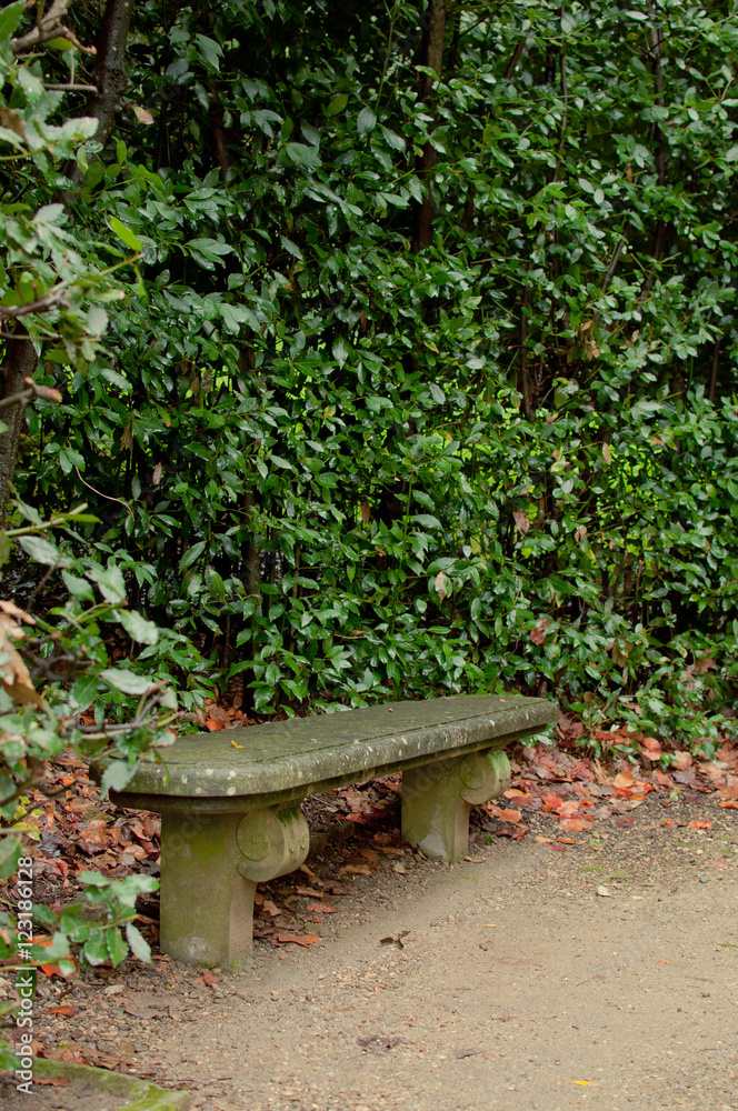 Lonely stone park bench in the Boboli gardens (Florence, Italy) Lonely stone park bench in the Boboli gardens (Florence, Italy)