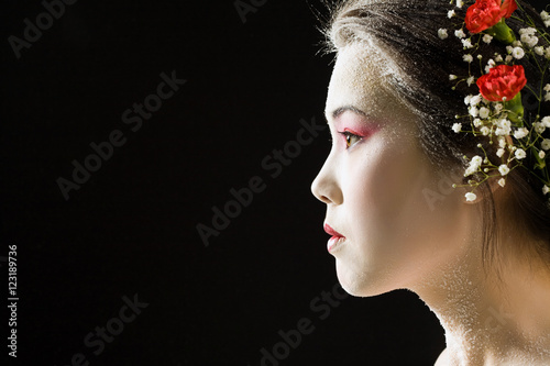 Profile of  japanese woman on a black background