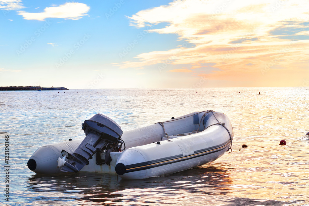 Fotografie Inflatable boat with a motor in the bay