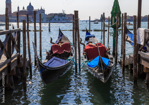 Gondolas on the dock on the background San Giorgio Maggiore Island