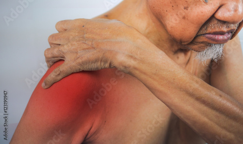 senior man hand holding healthy arm and massaging he shoulder in