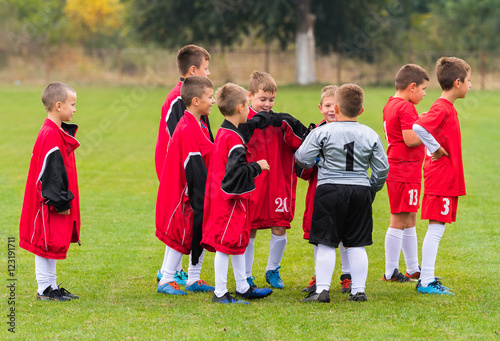 Boys preparing for football soccer match on sports field