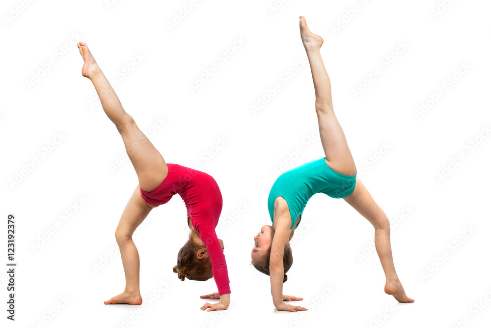 Flexible kids gymnasts, isolated on white background