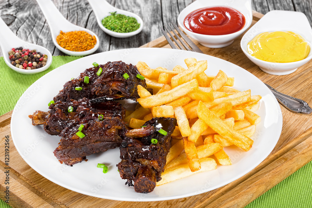 delicious fried ribs sprinkled with green onion with french fri delicious fried ribs sprinkled with green onion with french fri