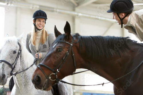 Image of couple enjoying horse training © pressmaster