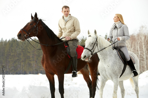 Portrait of wife and husband riding in open air