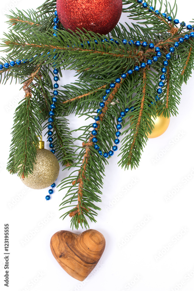 Fototapeta premium Christmas greeting card. Fir with balls and heart on white backg