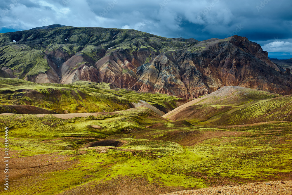 Valley National Park Landmannalaugar. On the gentle slopes of the mountains are snow fields and glaciers. Magnificent Iceland in the August Valley National Park Landmannalaugar. On the gentle slopes of the mountains are snow fields and glaciers. Magnificent Iceland in the August